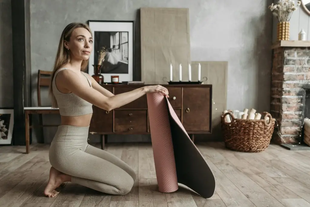 a-woman-in-active-wear-exercising-indoors-at-home