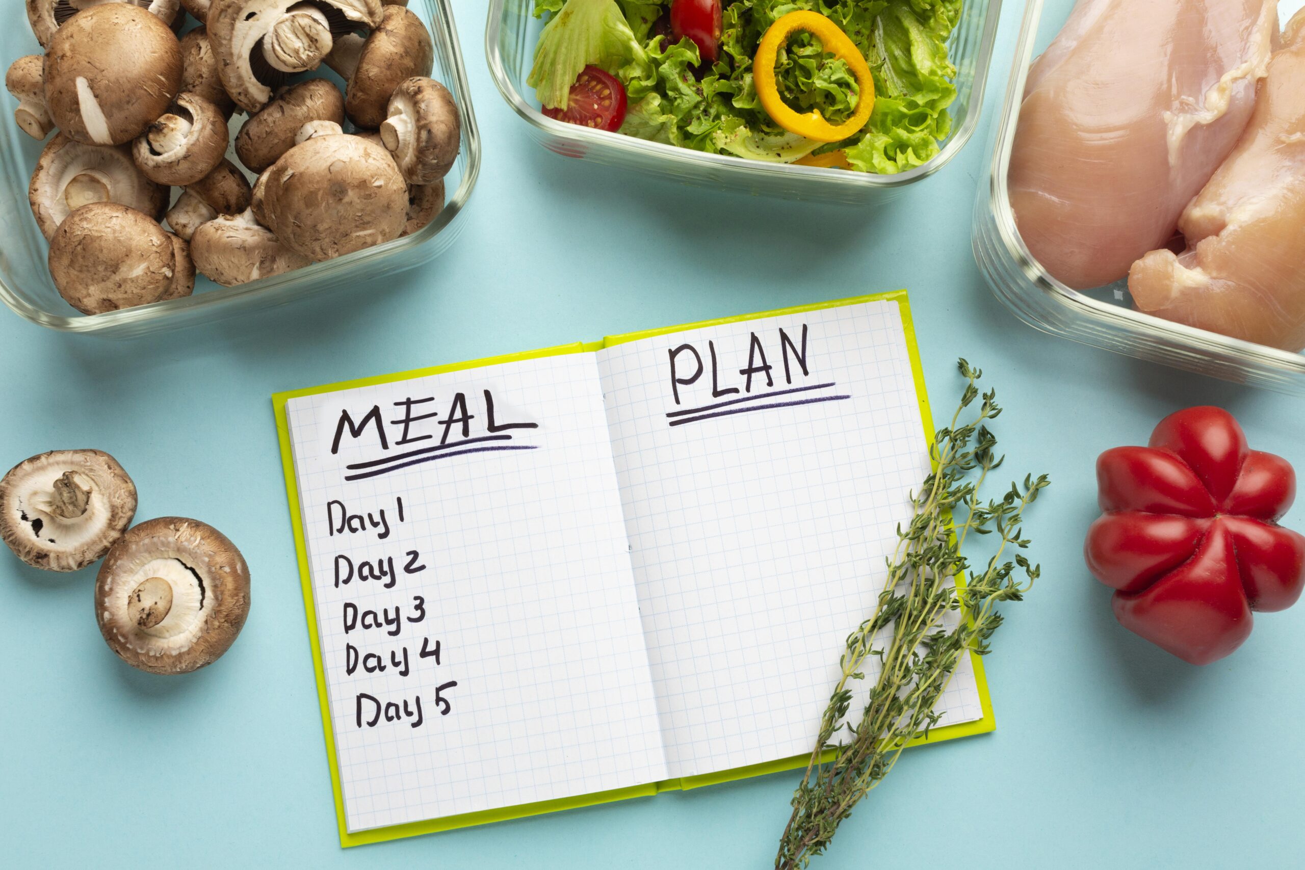 top-view-arrangement-with-meal-planning-notebook